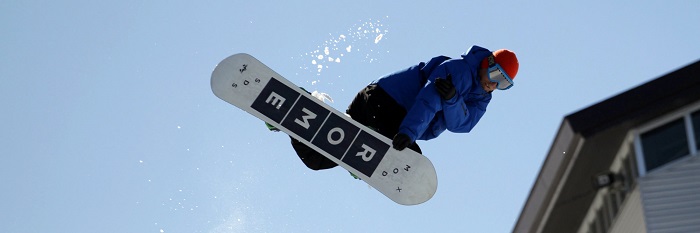 guy jumping with snowboard