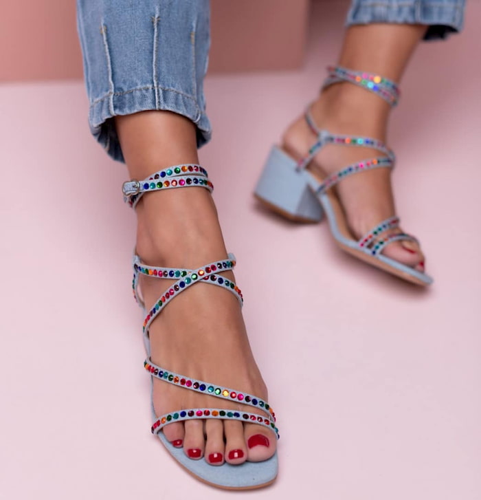 strappy heeled sandals and jeans