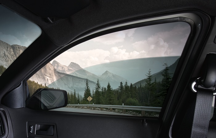 picture of an automatic car window with a view on the mountains