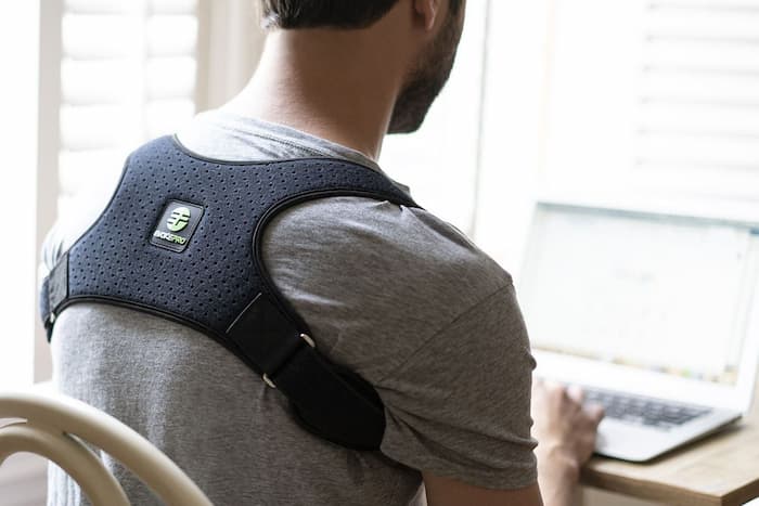 man wearing a Back Posture Support