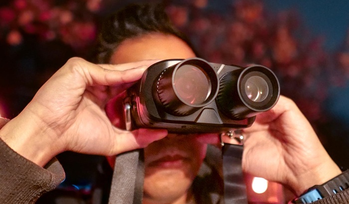 person with night vision binoculars