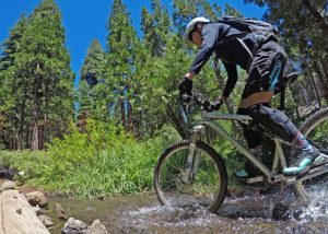 cyclist riding his bike in nature
