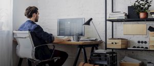 man sitting on ergonomic office chair while working at the office