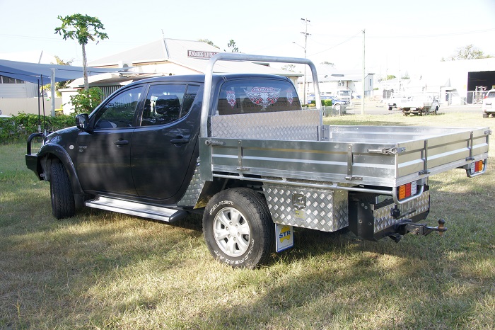 picture of aluminum ute tray on grass surface 