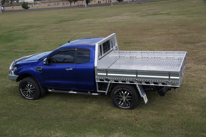 picture of blue aluminum ute tray on grass surface 