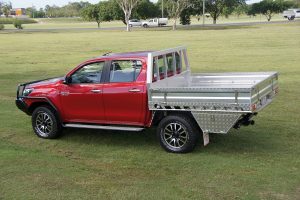 picture of red ute tray on grass surface