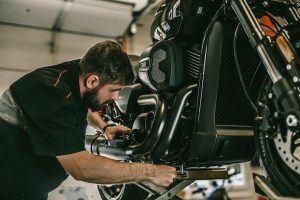 Taking care of motorcycle with repair tools
