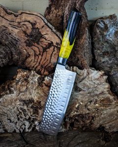 knife being stuck in wood because of his sharpness
