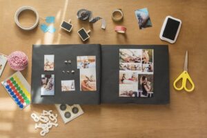 scrapbook with photos of friends and craft supplies