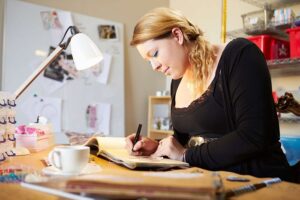 woman doing her memory journal