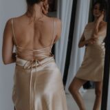 woman wearing mini beige slip dress