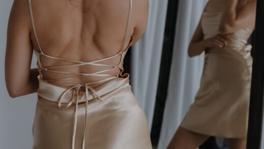 woman wearing mini beige slip dress