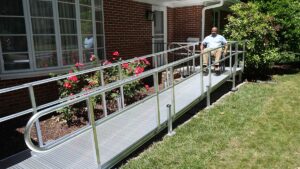 Man with wheelchair on ramp