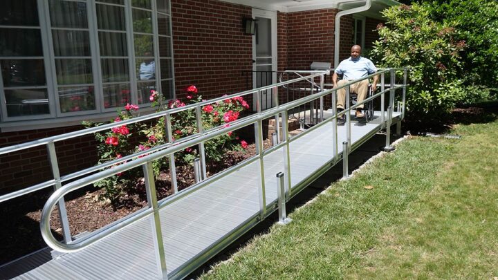 Man with wheelchair on ramp