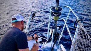 man washing his boat with deck wash pumps