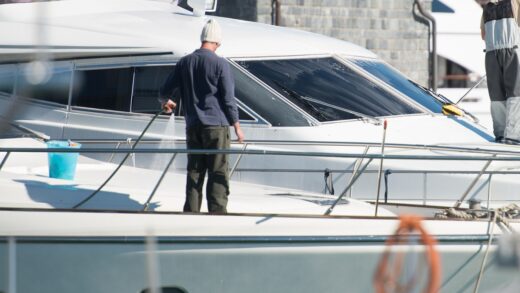 man washing his boat