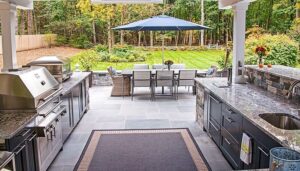 spacious outdoor kitchen with furniture