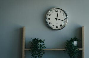 wall clock above the shelves in the home