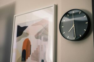 wall with art print and clock