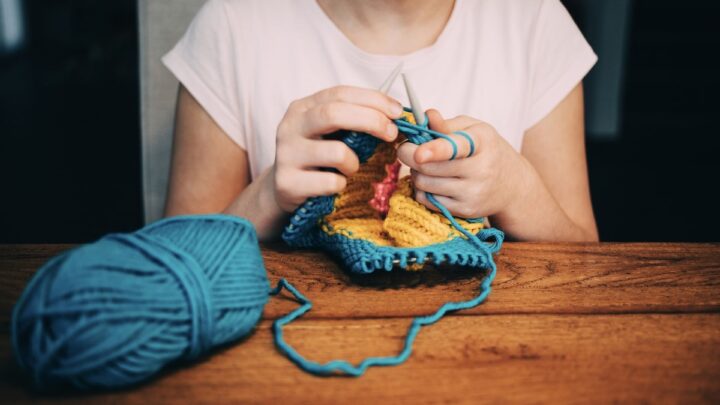woman knitting with needles