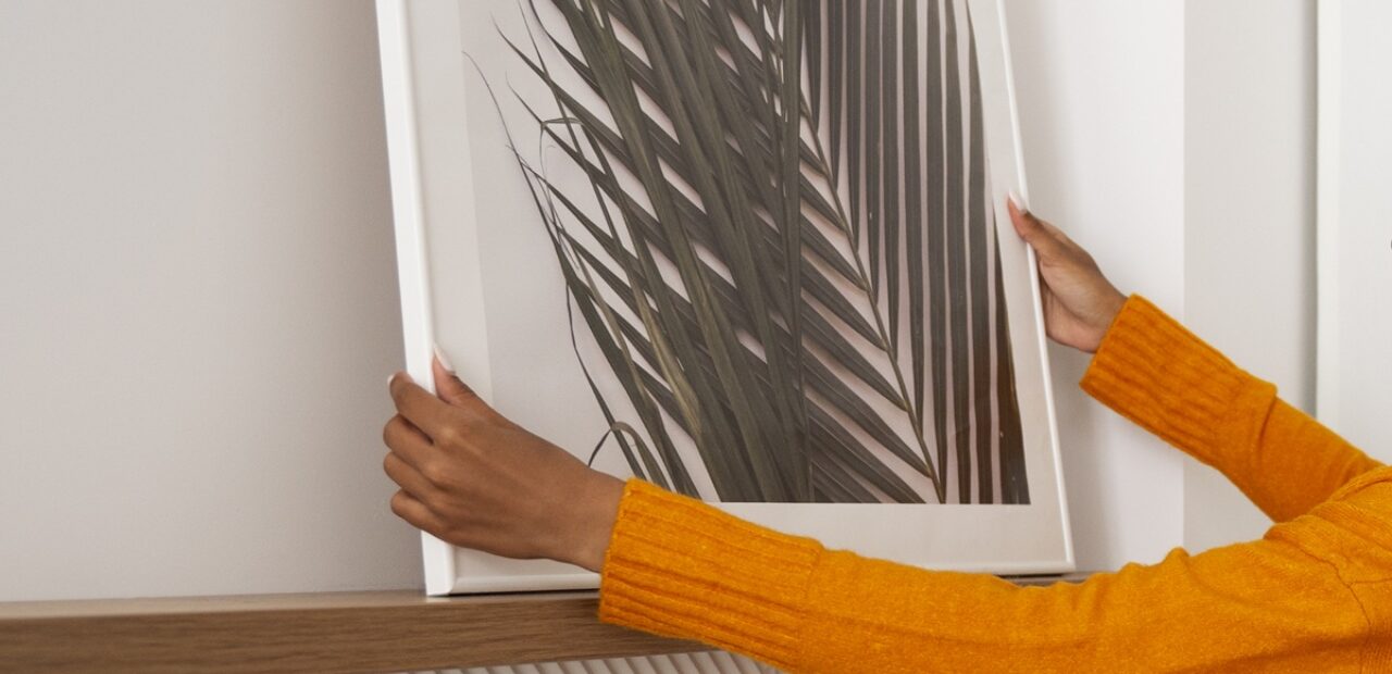 woman setting up a canvas print