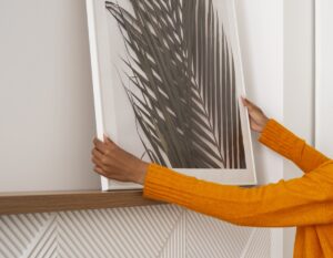 woman setting up a canvas print